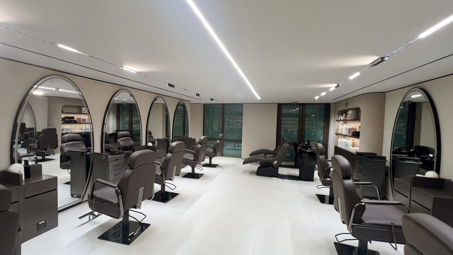 This stylish and chic beauty salon has just recently opened its doors inside Souk Al Bahar. Our team created some beautiful curved walls and custom display shelving throughout. Lighting is soft and complementary to the neutral tones of the walls and floors. Take your time going through these photos.